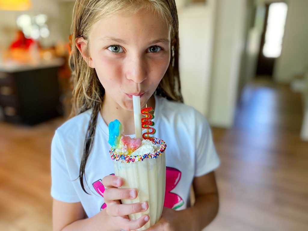 Girl sipping Vanilla Milkshake