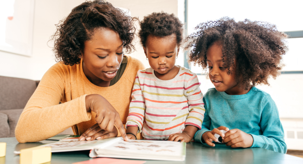 mom with kids reading a book