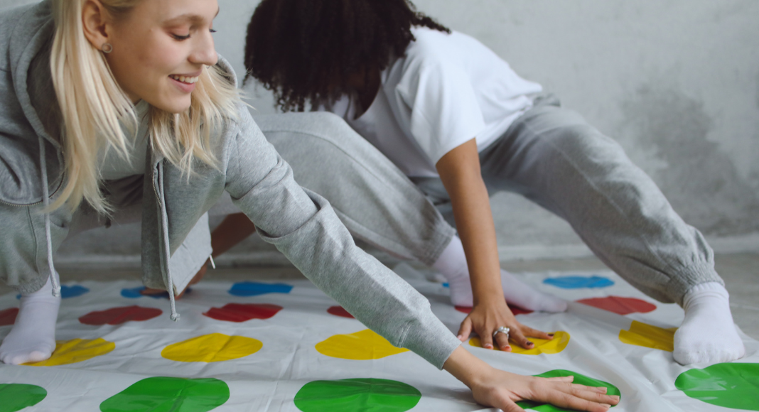 two women playing Twister